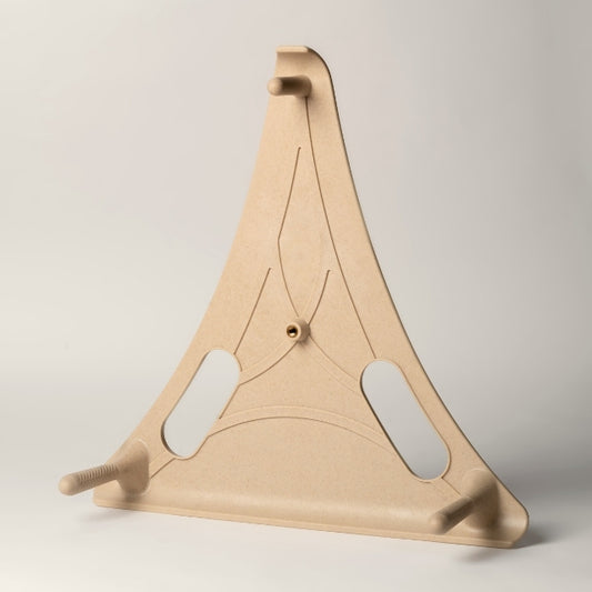The Reliefboard, a beige triangular back massage tool sits upright on a white background.